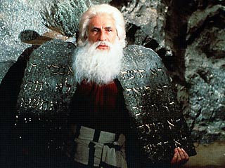 Mel Brooks as Moses holding the 10 commandments.