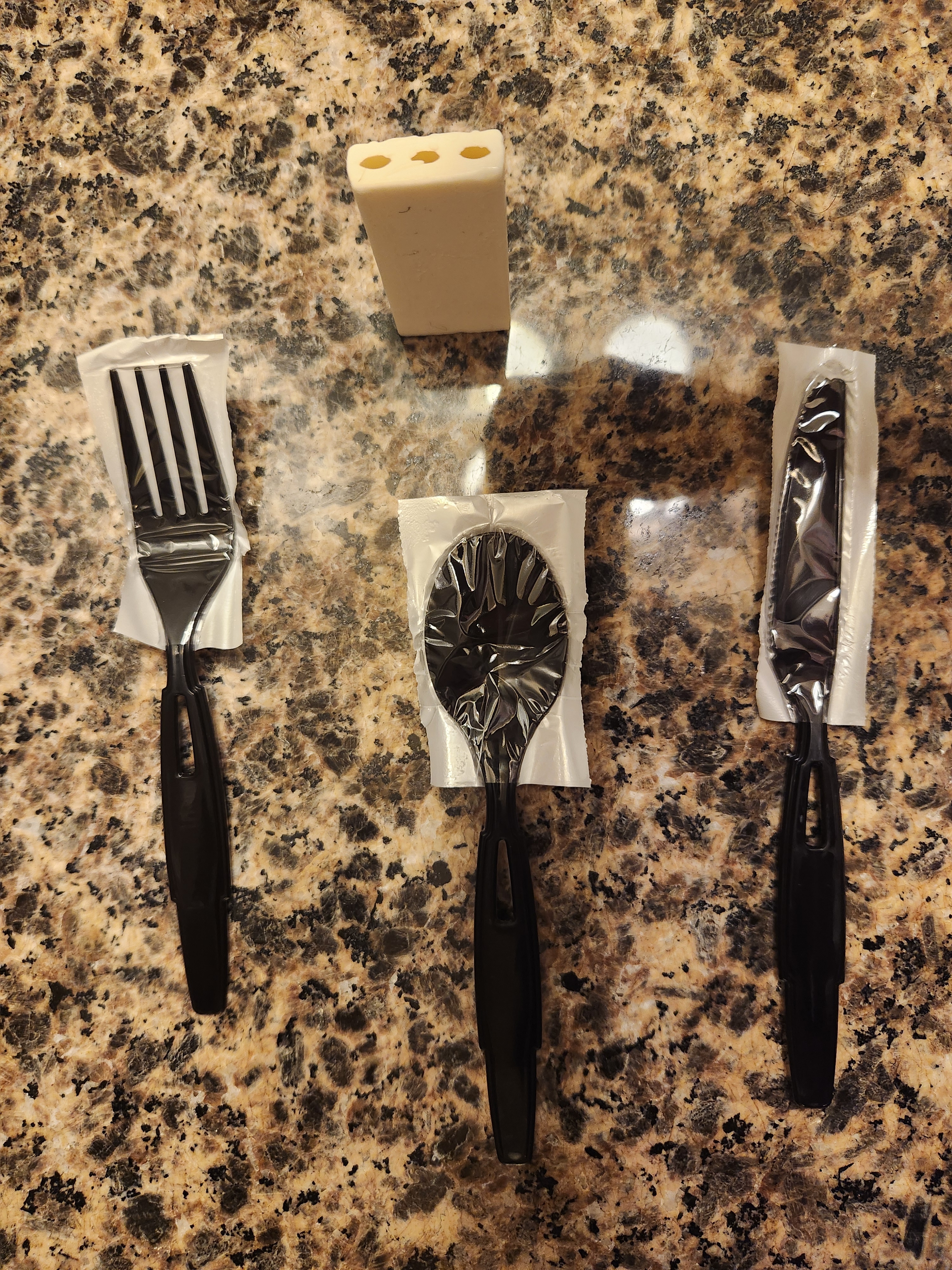 Picture of disposable silverware and soap from a hotel stay